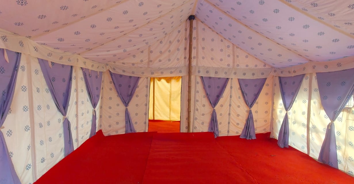 Tents lined up against the hills